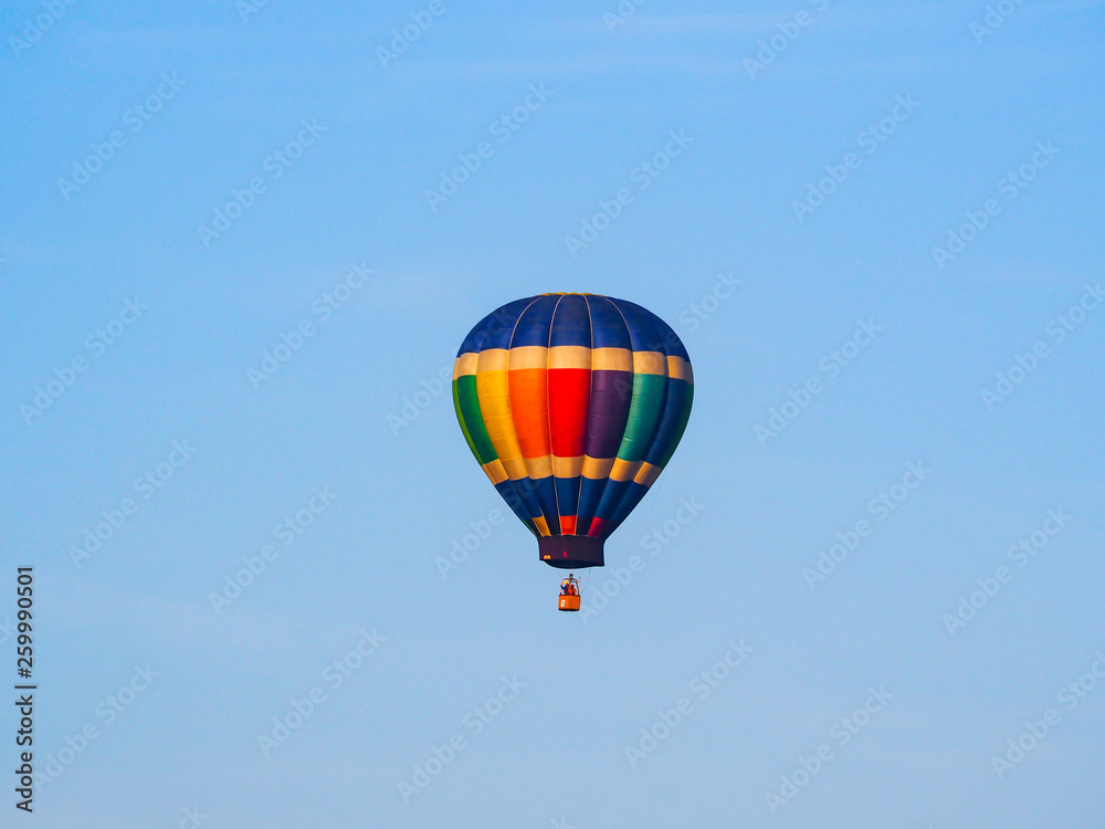 Fototapeta premium Colorful Hot Air Balloon Floating Blue Sky
