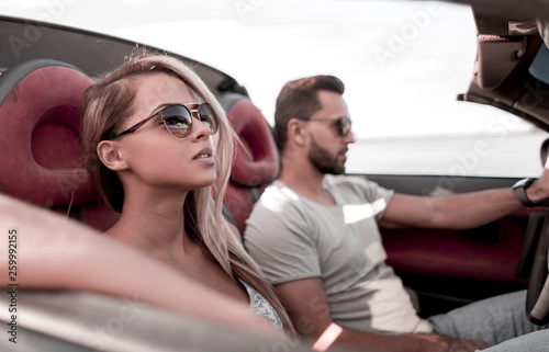 close up.the couple traveling in a convertible © ASDF