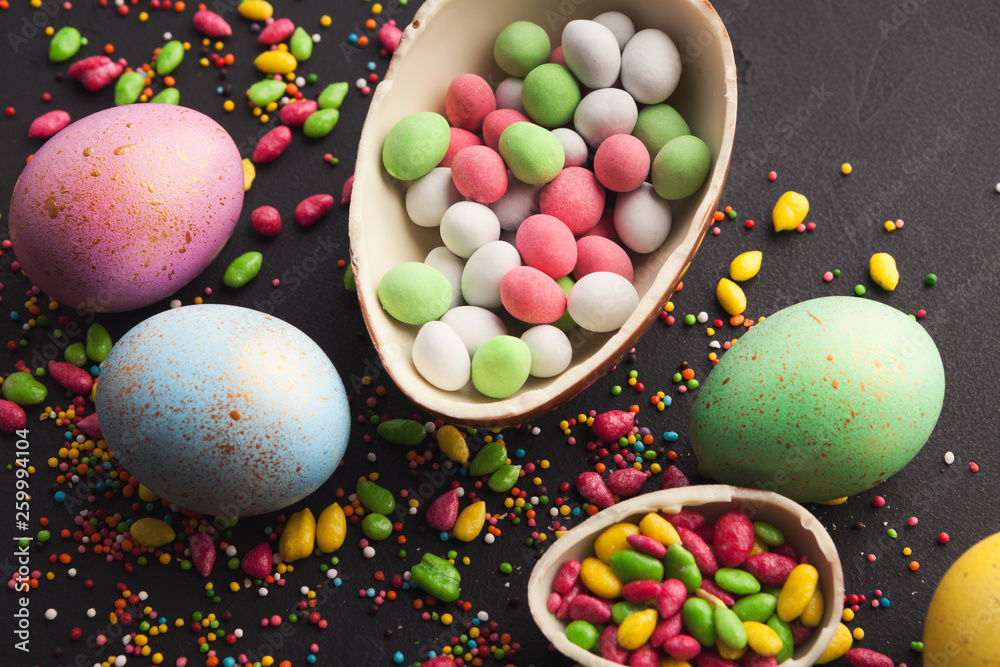 Chocolate egg and colorful candies
