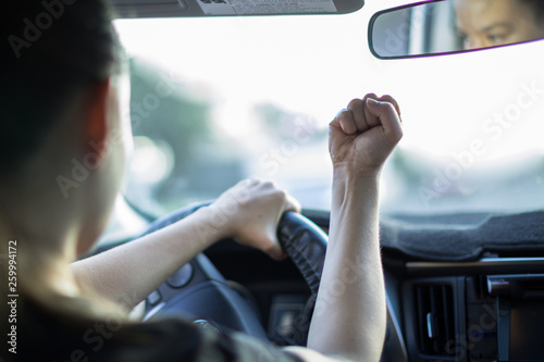 Εκτύπωση καμβά A reckless young female driver angry  road rage, behind the wheel of a car