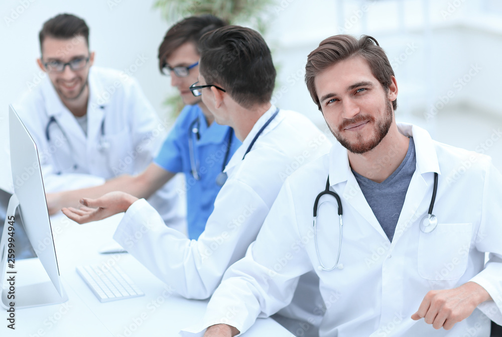 smiling doctor on the background of the medical offic smiling doctor on the background of the medical offic