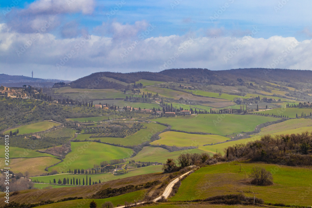 Green fields and meadows on a typical Tuscany landscape, Italy