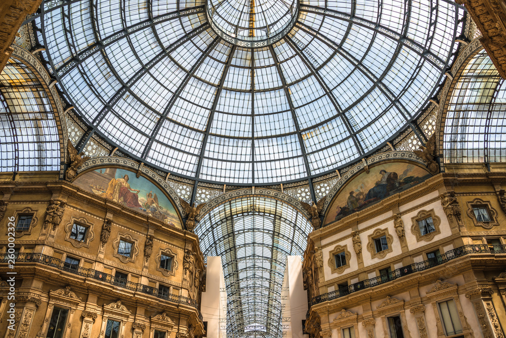 Geometrical and historical Interior of Galleria Vittorio Emanuele II in front of Cathedral of Milano, Milan, Italy