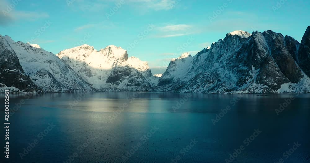 Aerial view over the water with reflection from the mountians of the Lofoten Islands, Norway Aerial view over the water with reflection from the mountians of the Lofoten Islands, Norway