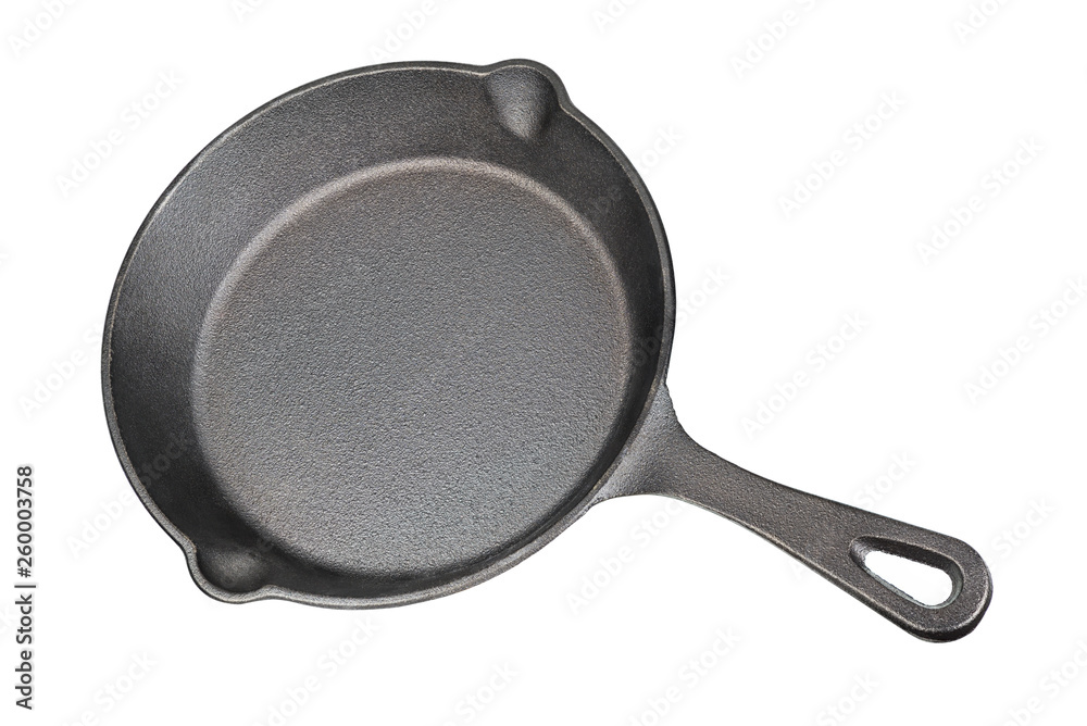 Black cast-iron skillet isolated Black cast-iron skillet isolated