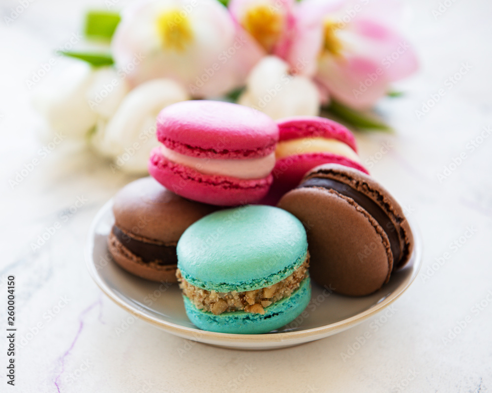 Colorful macaroons and tulips