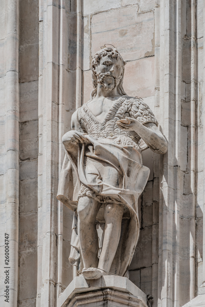 Decorative Religious figure at facade of the Cathedral of Milano, Milan, Italy