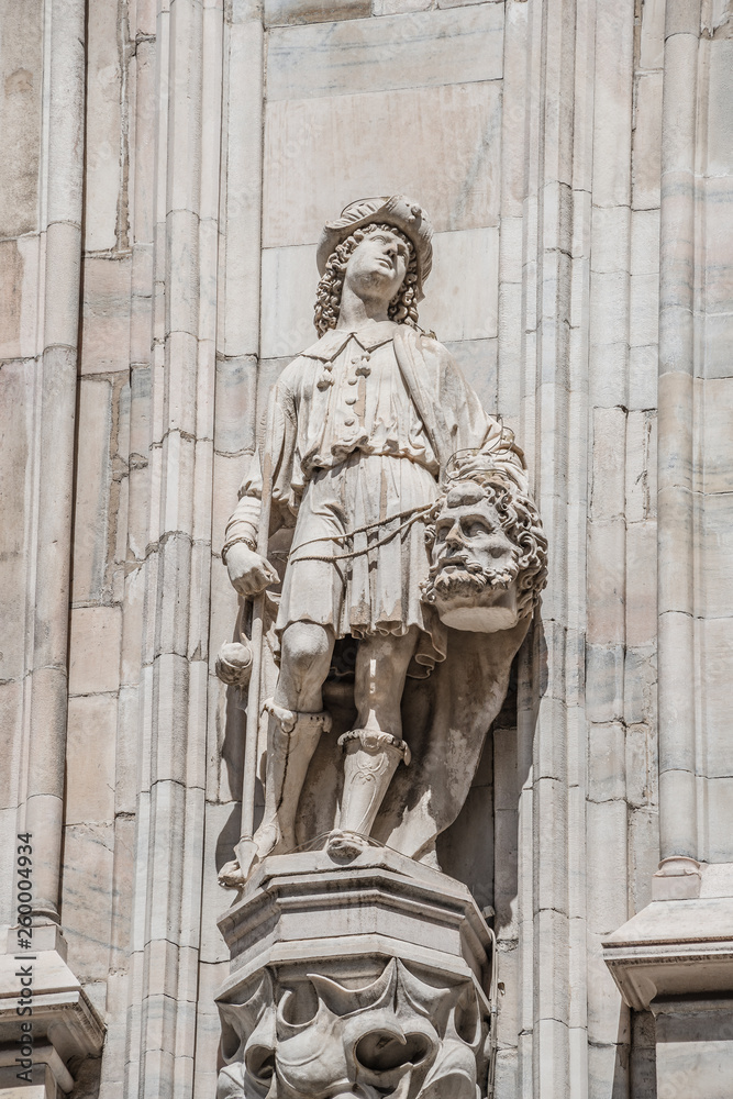 Fototapeta premium Decorative Religious figure at facade of the Cathedral of Milano, Milan, Italy