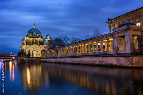 Beautiful view of illuminated Berliner Dom (Berlin Cathedral) and Alte Nationalgalerie on Museum Island and reflections on the Spree River in Berlin, Germany, at dusk. photo