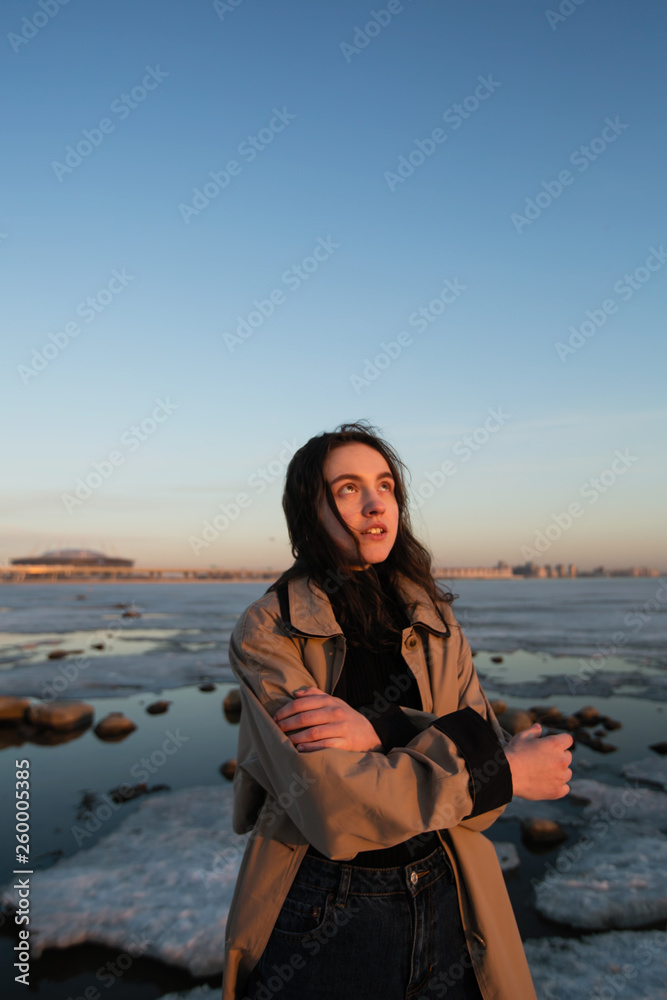 Beautiful girl portrait. Photo shoot near river at winter.