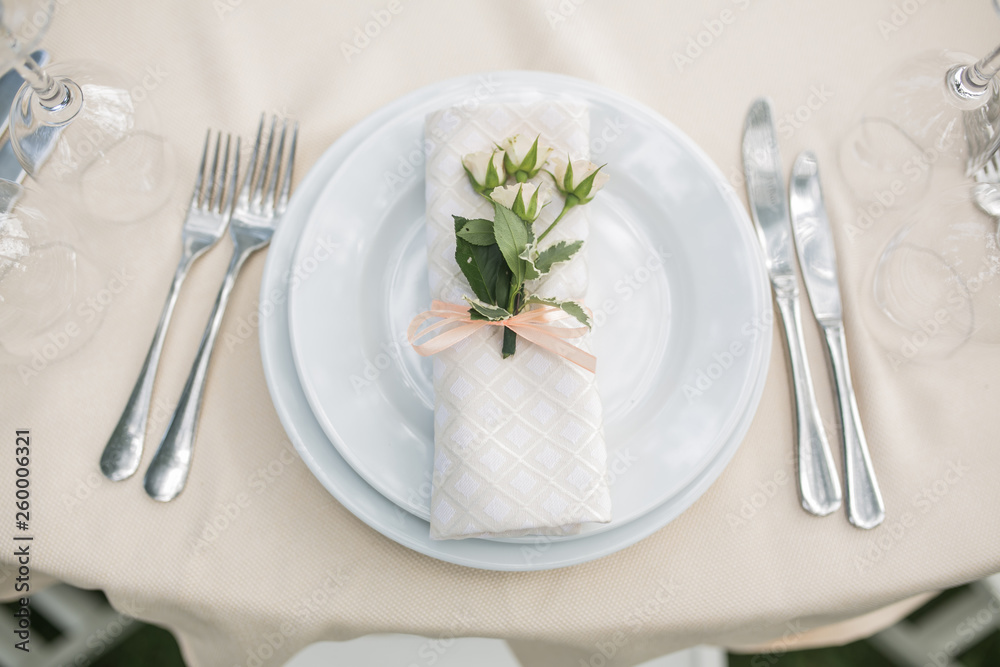 Wine glasses, napkins and salad on the table for the wedding banquet. Wine glasses, napkins and salad on the table for the wedding banquet.