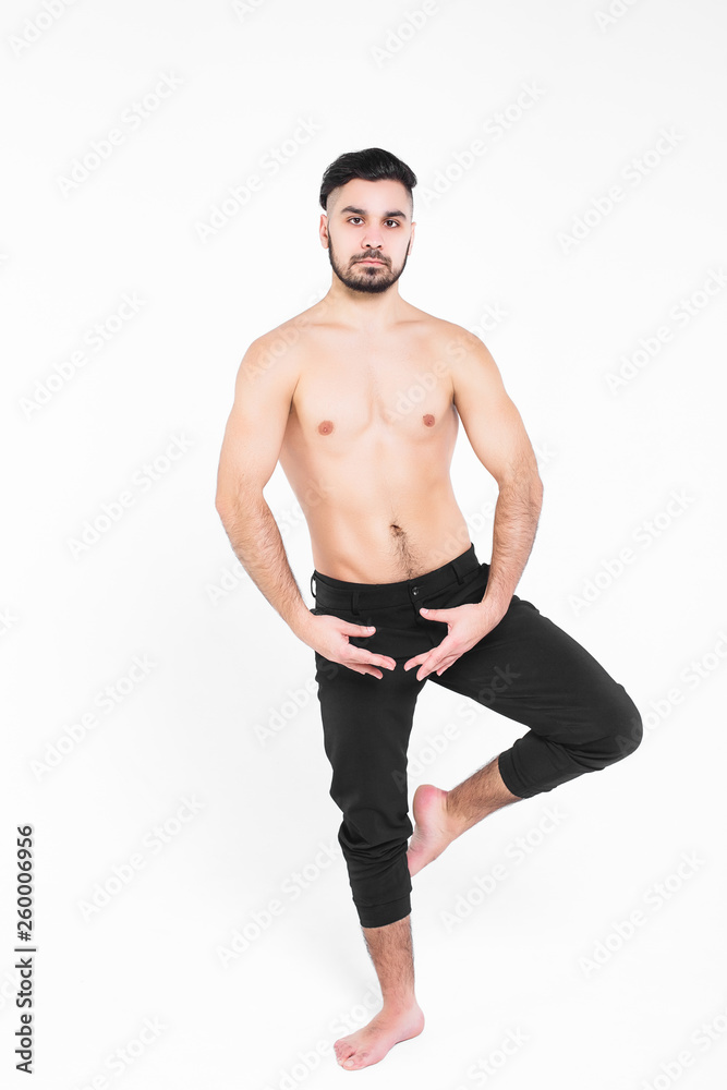 Young , attractive modern dancer posing over white background