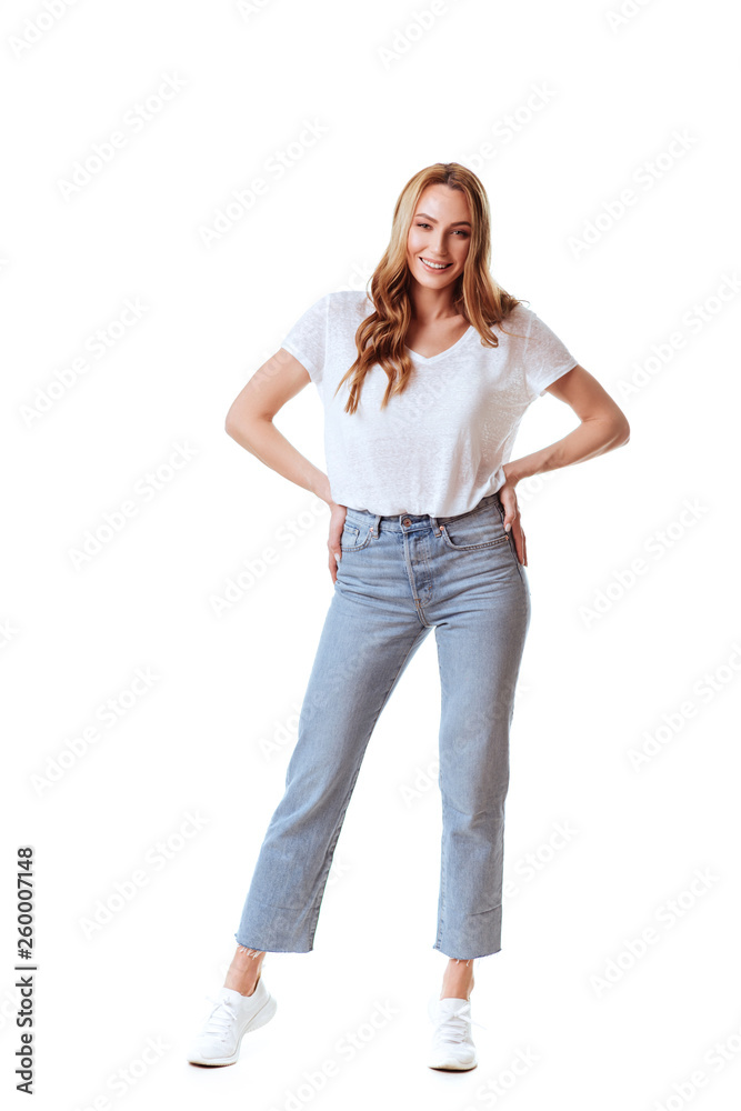 Portrait of a happy woman standing with arms folded