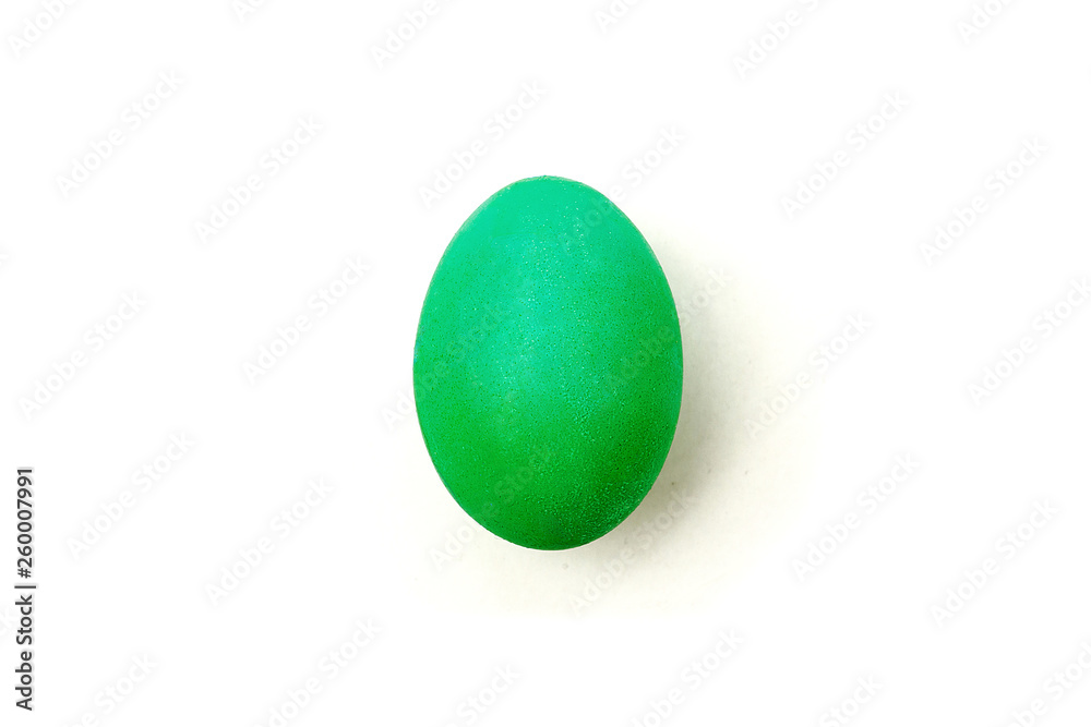 Green painteded chicken egg isolated on the white background. Green painteded chicken egg isolated on the white background.