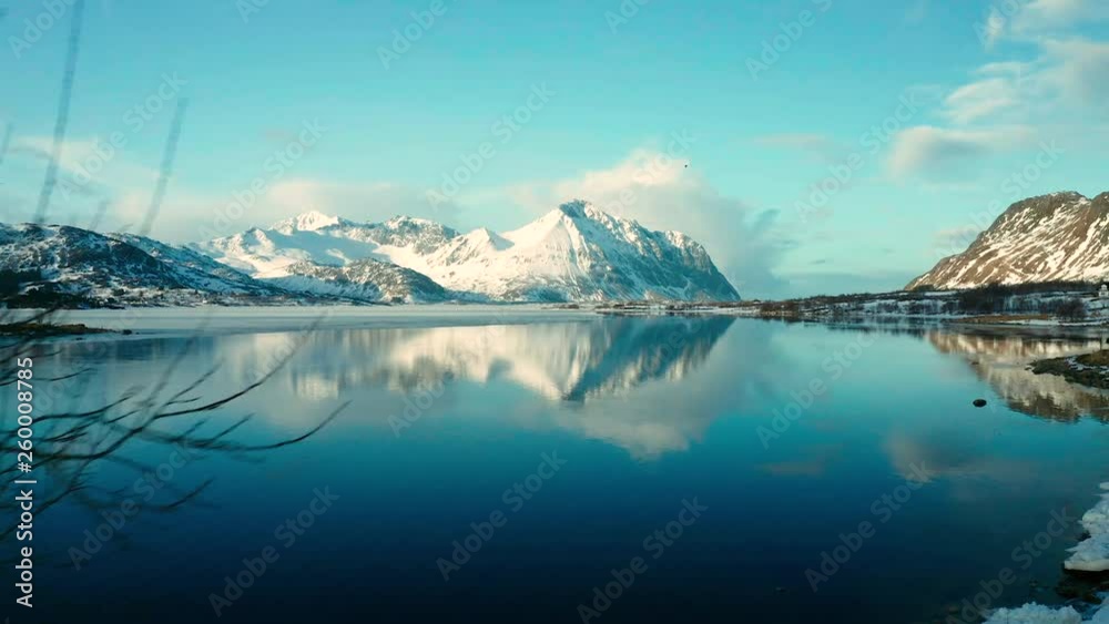 Aerial view over the water with reflection from the mountians of the Lofoten Islands, Norway