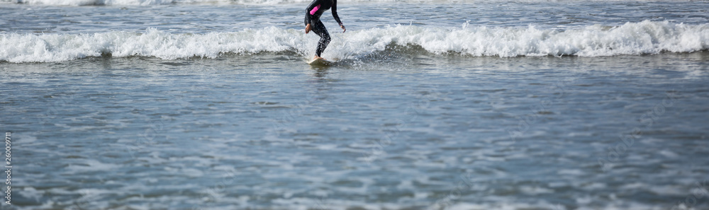 Surfer woman practice surfing in the white water Surfer woman practice surfing in the white water