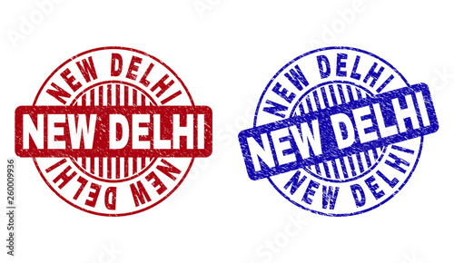 Grunge NEW DELHI round stamp seals isolated on a white background. Round seals with grunge texture in red and blue colors. Vector rubber watermark of NEW DELHI caption inside circle form with stripes.