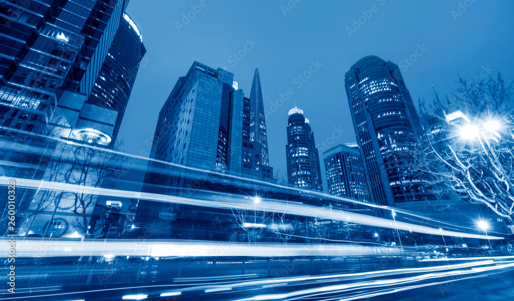 Fototapeta premium Urban Nightscape Architecture Street and Fuzzy Car Lights..