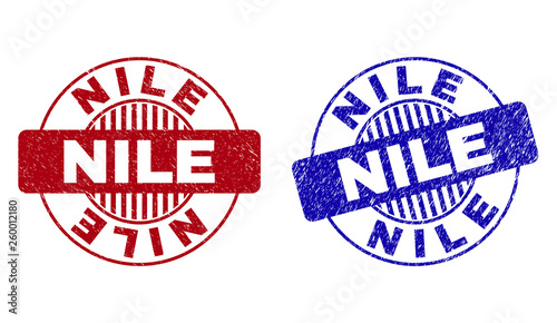 Grunge NILE round stamp seals isolated on a white background. Round seals with grunge texture in red and blue colors. Vector rubber overlay of NILE text inside circle form with stripes.