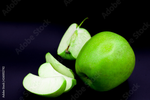 green apple cut in pieses photo