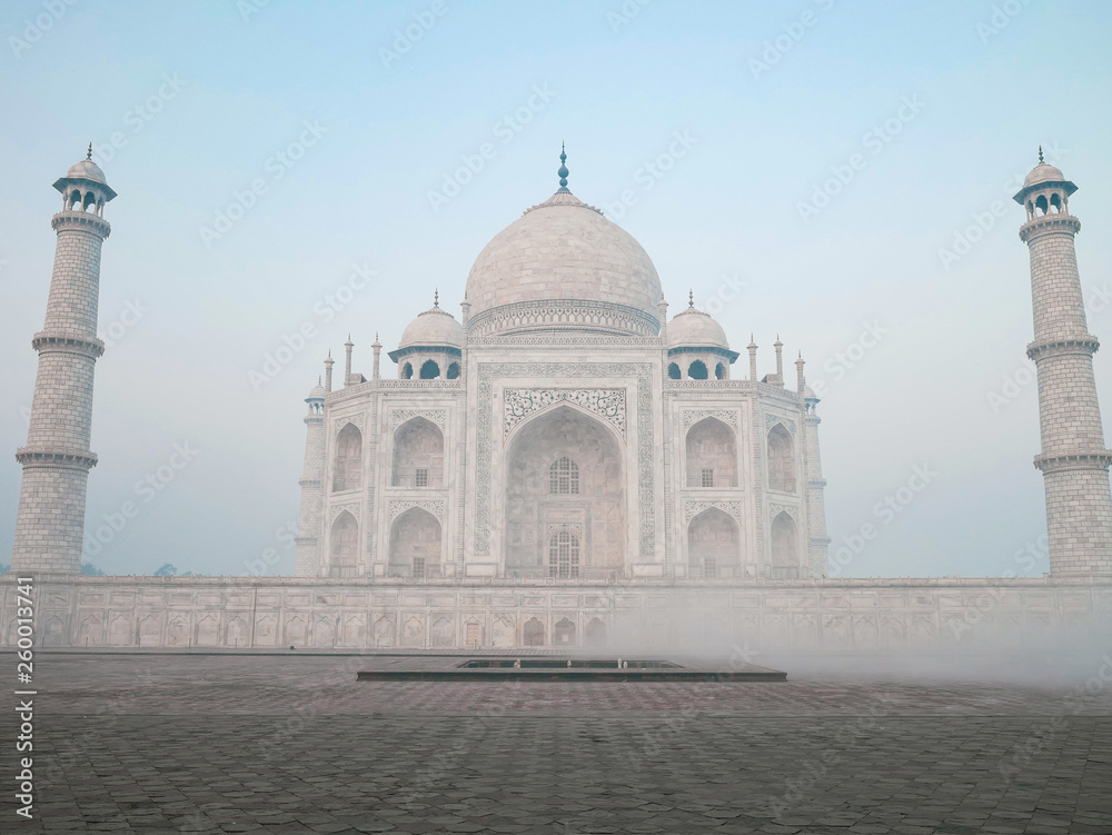 Taj mahal landmard of Agra, India sunrise time with foggy