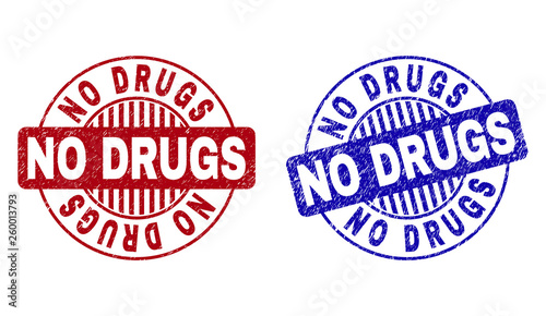 Grunge NO DRUGS round stamp seals isolated on a white background. Round seals with grunge texture in red and blue colors. Vector rubber imitation of NO DRUGS text inside circle form with stripes.