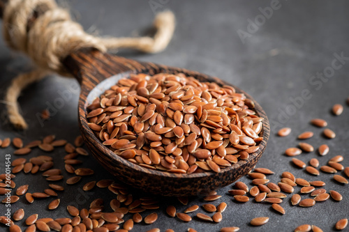 Flax seeds on wooden spoon photo