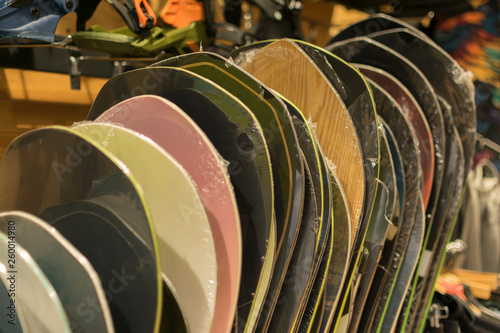  Ski shop sale. Rows of colorful snowboards in sport equipment store