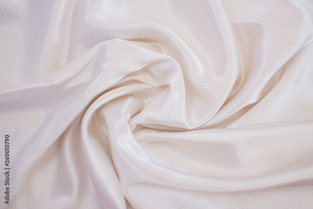 Silk wrinkled white fabric. View from above. Textile and texture concept - close up of crumpled silk white wavy fabric background Silk wrinkled white fabric. View from above. Textile and texture concept - close up of crumpled silk white wavy fabric background