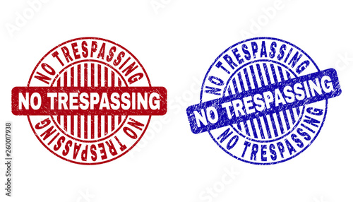 Grunge NO TRESPASSING round stamp seals isolated on a white background. Round seals with grunge texture in red and blue colors.