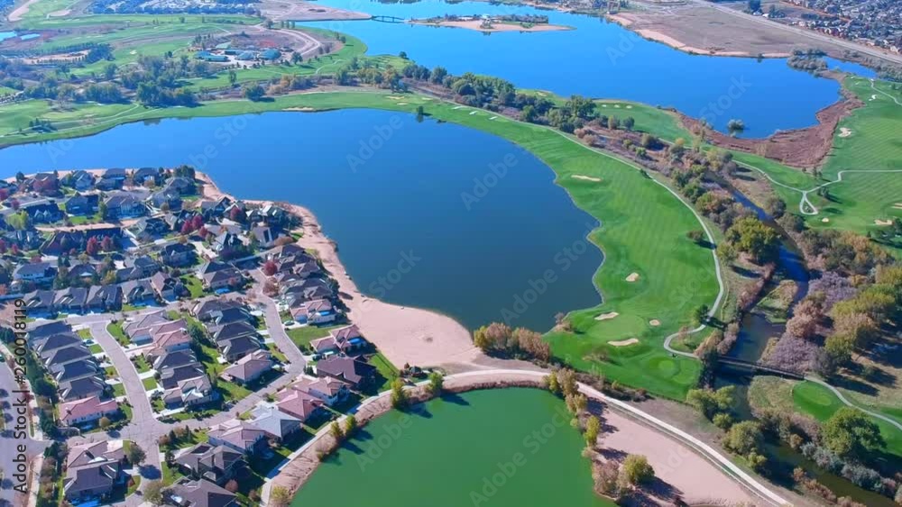 Beautiful view  of houses and lakes and a golf court in Windsor, Colorado.