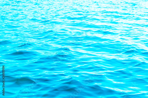 View of a Crystal clear sea water texture. View from above Natural blue background. Turquoise ripple water reflection in tropical beach. Blue ocean wave. Summer sea. Top view