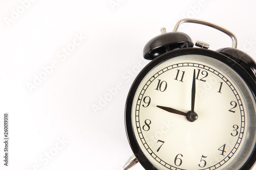 Time Punctuality Concept with black alarm clock.