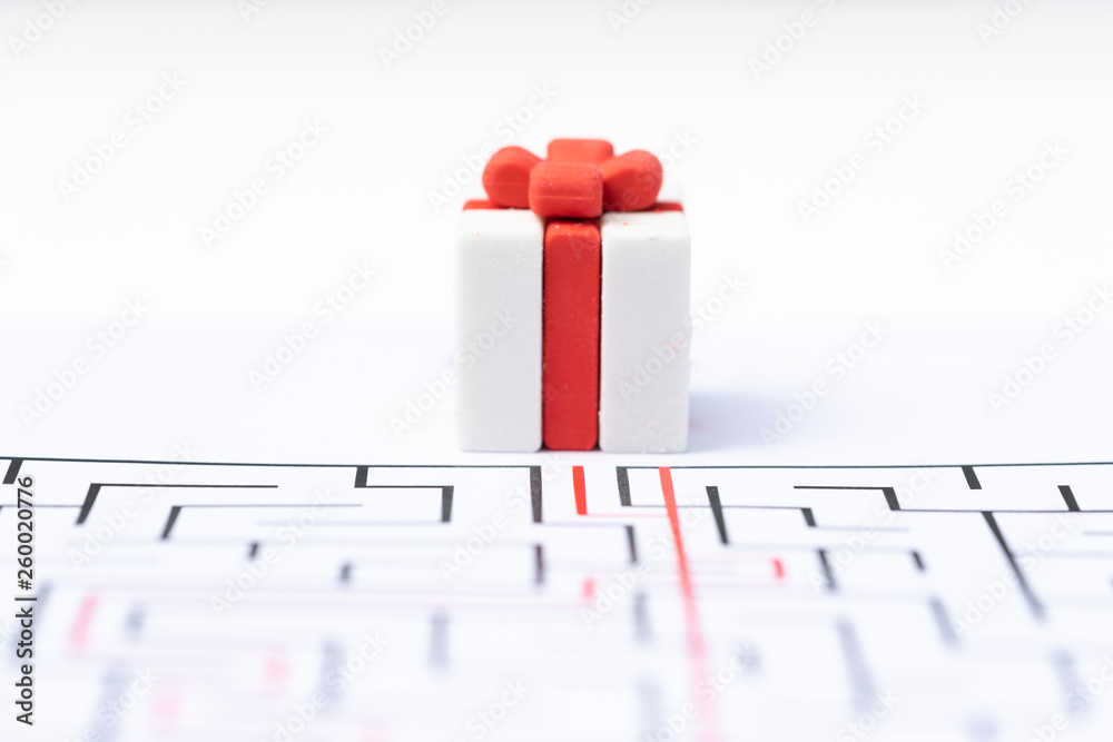 Fotografie Gift box in the labyrinth or maze