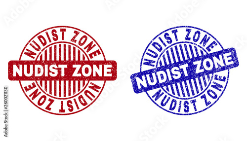 Grunge NUDIST ZONE round stamp seals isolated on a white background. Round seals with distress texture in red and blue colors.