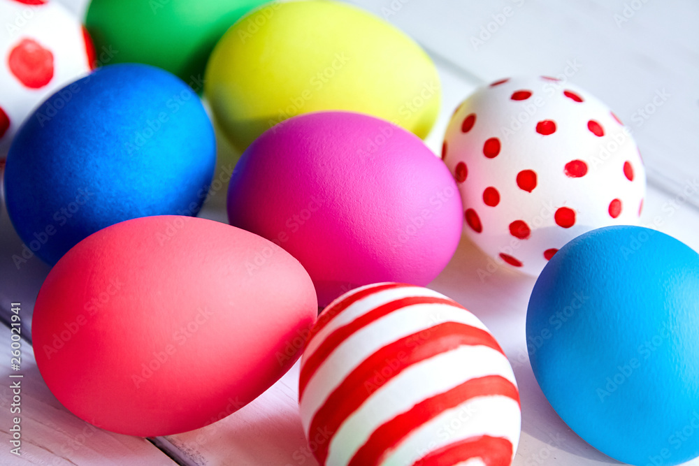 Colorful Easter eggs on wooden background