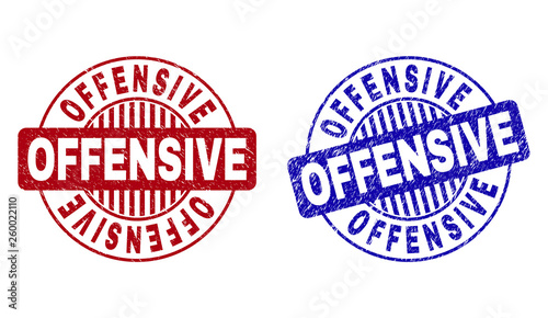 Grunge OFFENSIVE round stamp seals isolated on a white background. Round seals with grunge texture in red and blue colors. Vector rubber overlay of OFFENSIVE caption inside circle form with stripes.