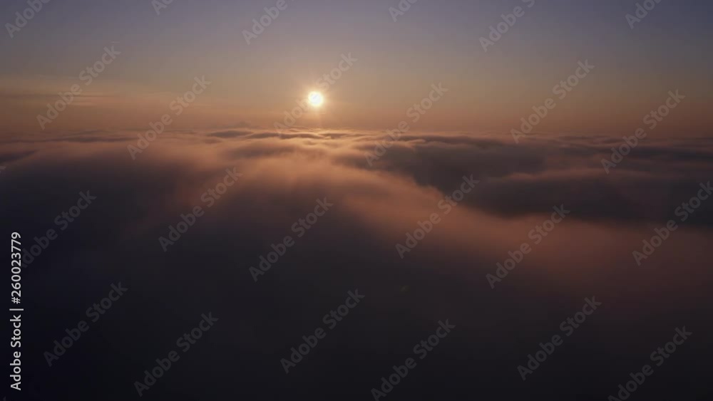 Slow Flying over clouds towards golden sunset, aerial shot Slow Flying over clouds towards golden sunset, aerial shot