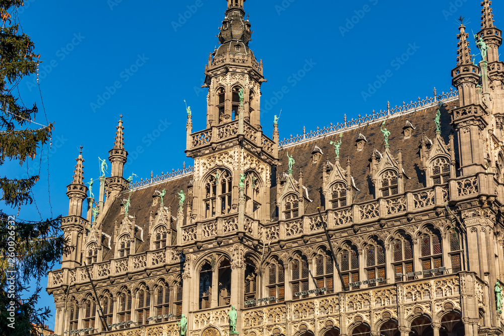 Striking Gothic Revival facade and roof of the Museum of the City of Brussels. The building also known as the Maison du Roi (