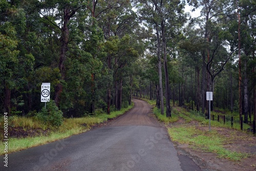 Secluded wet sealed and unsealed rural road