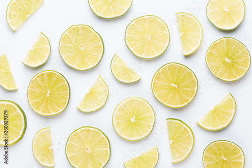 Lime fruit slices on white background.