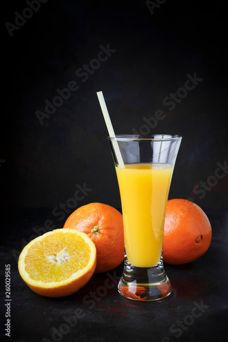 Dark natural orange fruit with straw