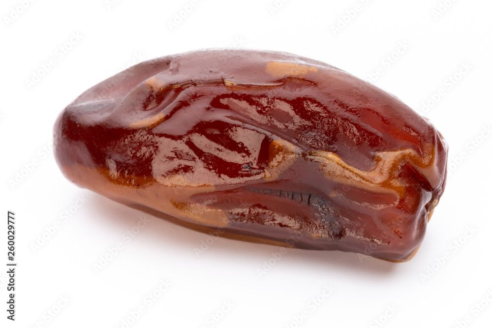 Dry dates isolated on white background. Top view. Flat lay pattern. Dry dates isolated on white background. Top view. Flat lay pattern.