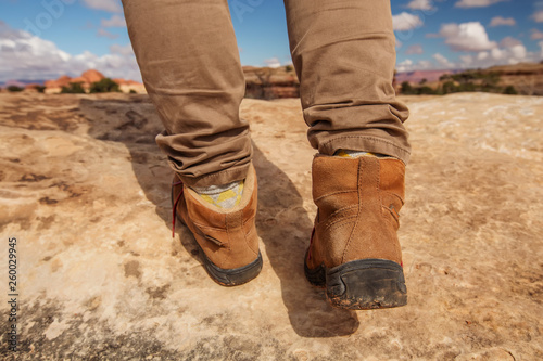 Womens trekking shoes while hiking in mountains © Maygutyak