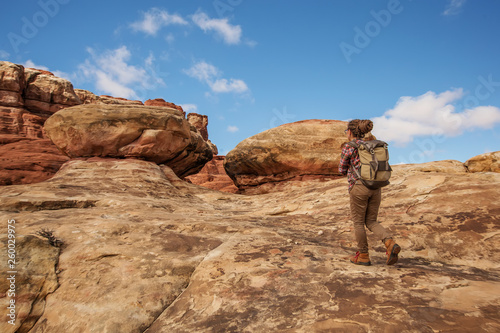 Hiker in Canyonlands National park, needles in the sky, in Utah, USA