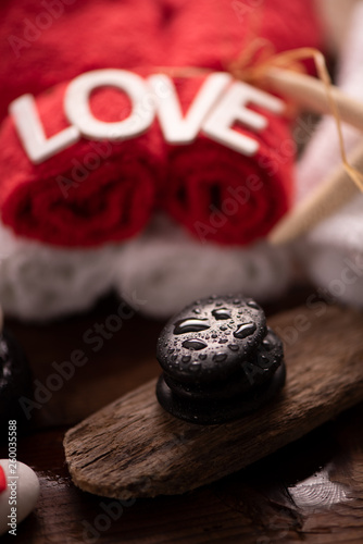Wellness docoration on valentine`s day with towels and stones