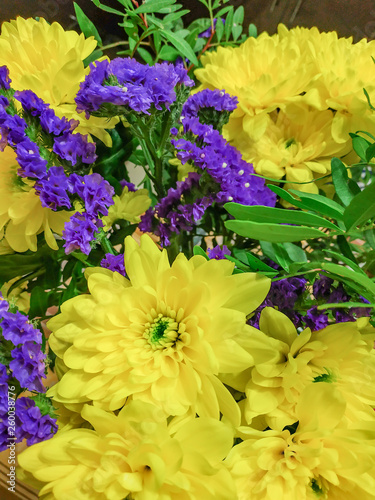 Fototapeta Naklejka Na Ścianę i Meble -  bouquet of flowers yellow chrysontemum background texture holiday