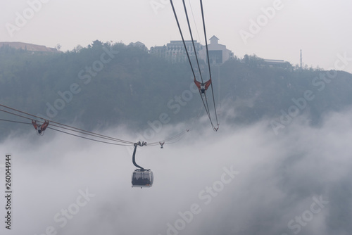 Sapa Vietnam Tourist travel by cable car to Fansipan peak in morning fog,the highest mountain in the Indochinese Peninsula with longest cable road in the world