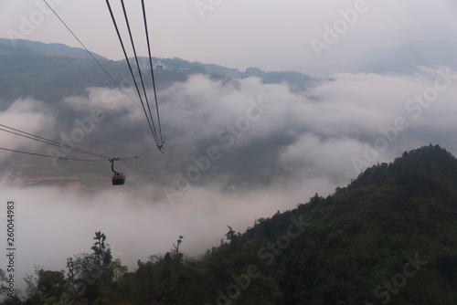 Sapa Vietnam Tourist travel by cable car to Fansipan peak in morning fog,the highest mountain in the Indochinese Peninsula with longest cable road in the world
