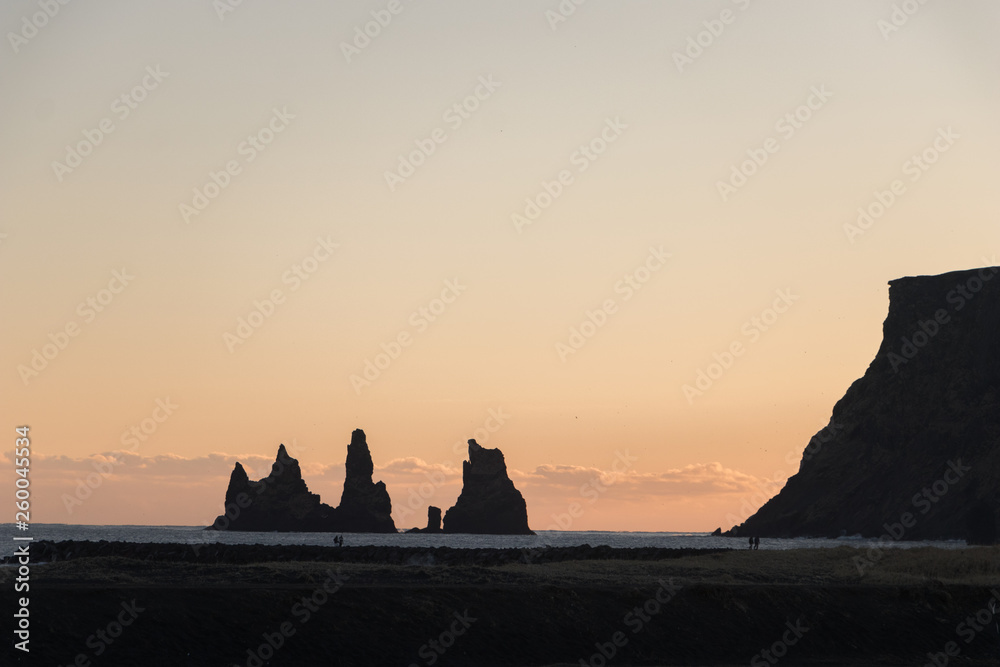 Reynisdrangar in sunset.Reynisfjara is a world-famous black-sand beach found on the South Coast of Iceland